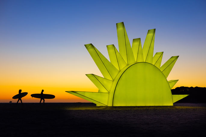 Large illuminated sun structure installed on a beach