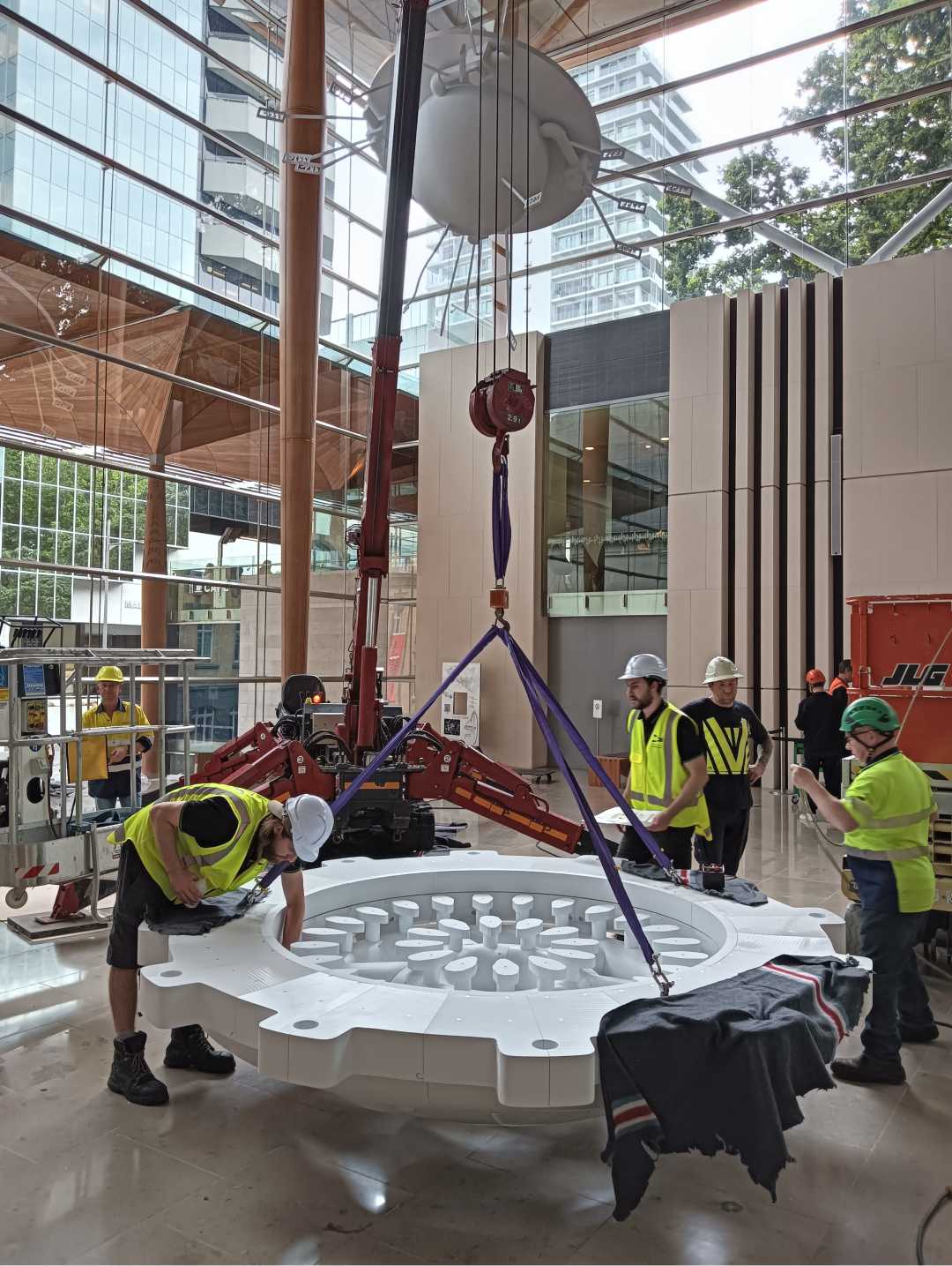 Precision rigging and placement of a large suspended artwork