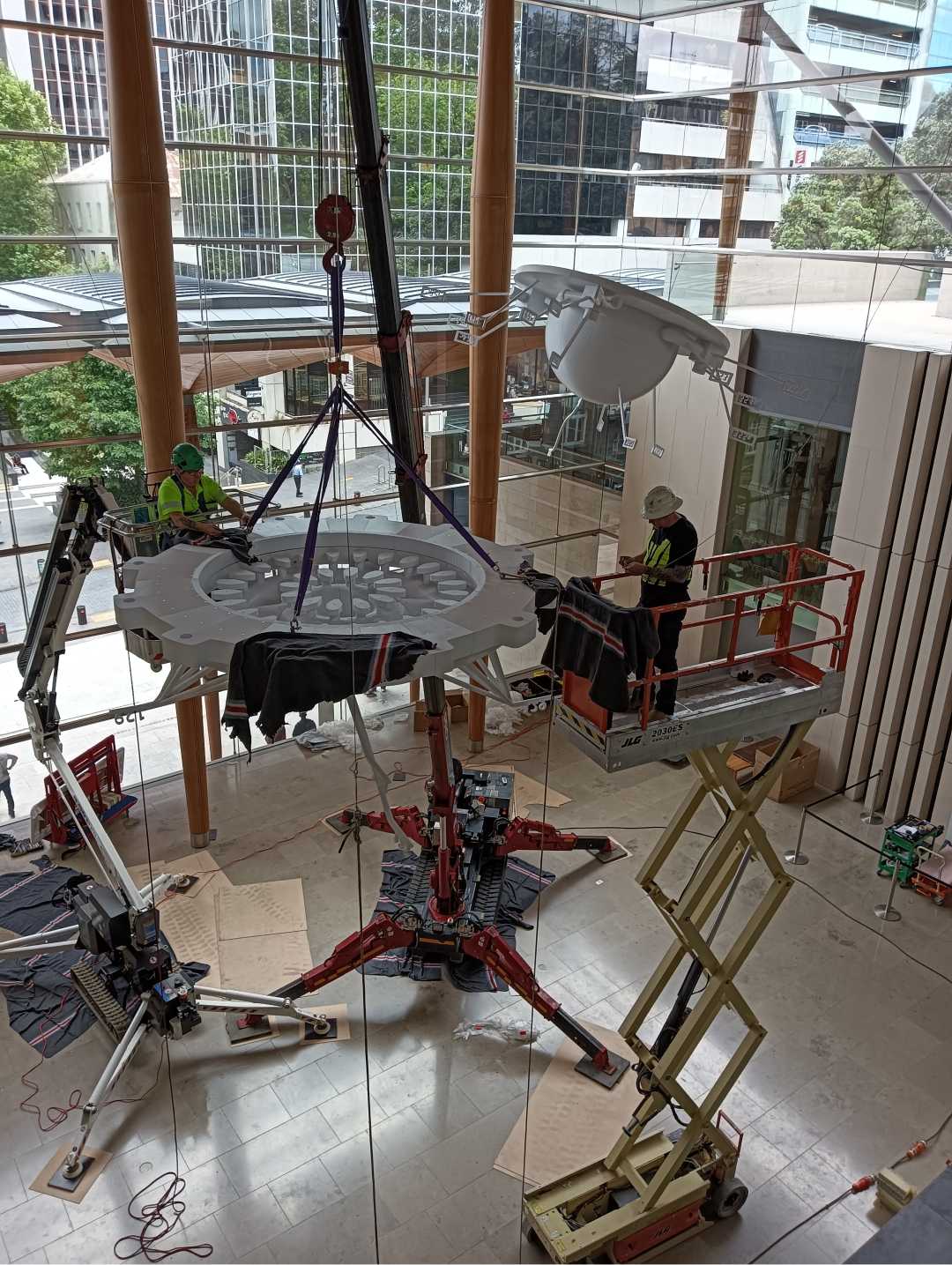 Complex internal rigging lift for a large suspended installation